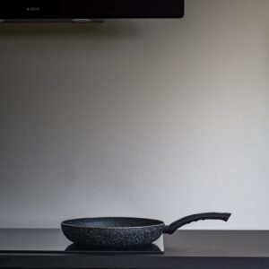 black ceramic bowl on white table